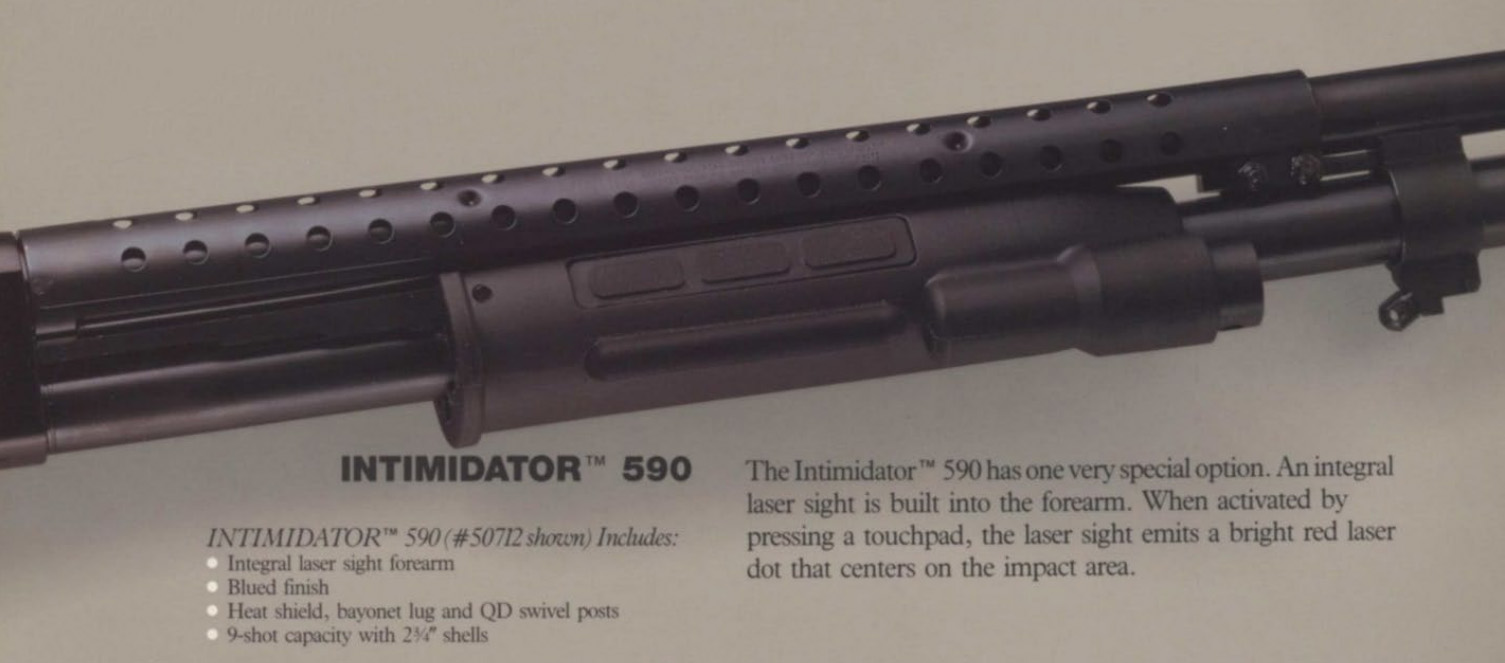 Close-up of the Mossberg Intimidator 590 firearm, highlighting the integral laser sight feature integrated into the forearm.