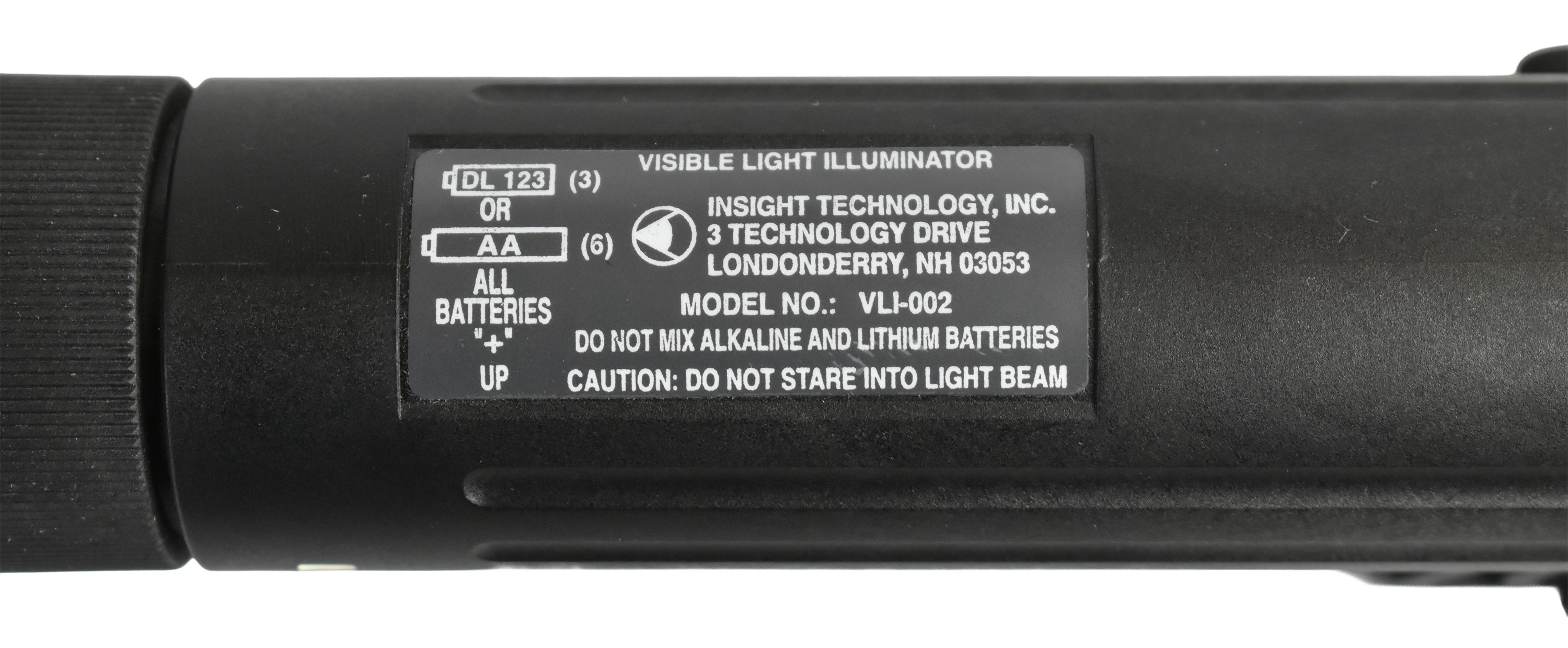 Close-up view of the Insight VLI (Visible Light Illuminator) showing the product label with battery specifications and warnings.