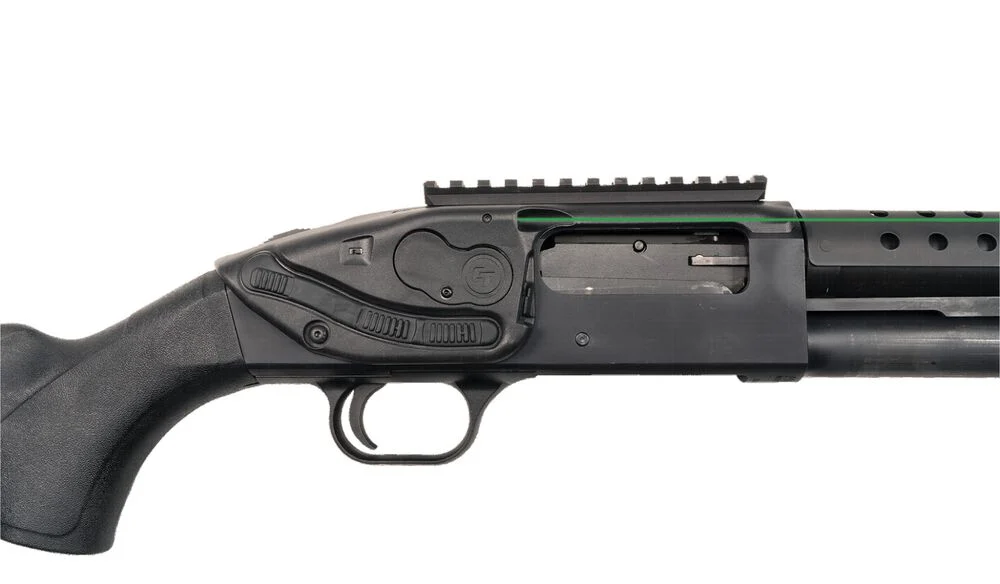Close-up view of a Mossberg shotgun featuring a laser attachment, showcasing the trigger, controls, and tactical rail.