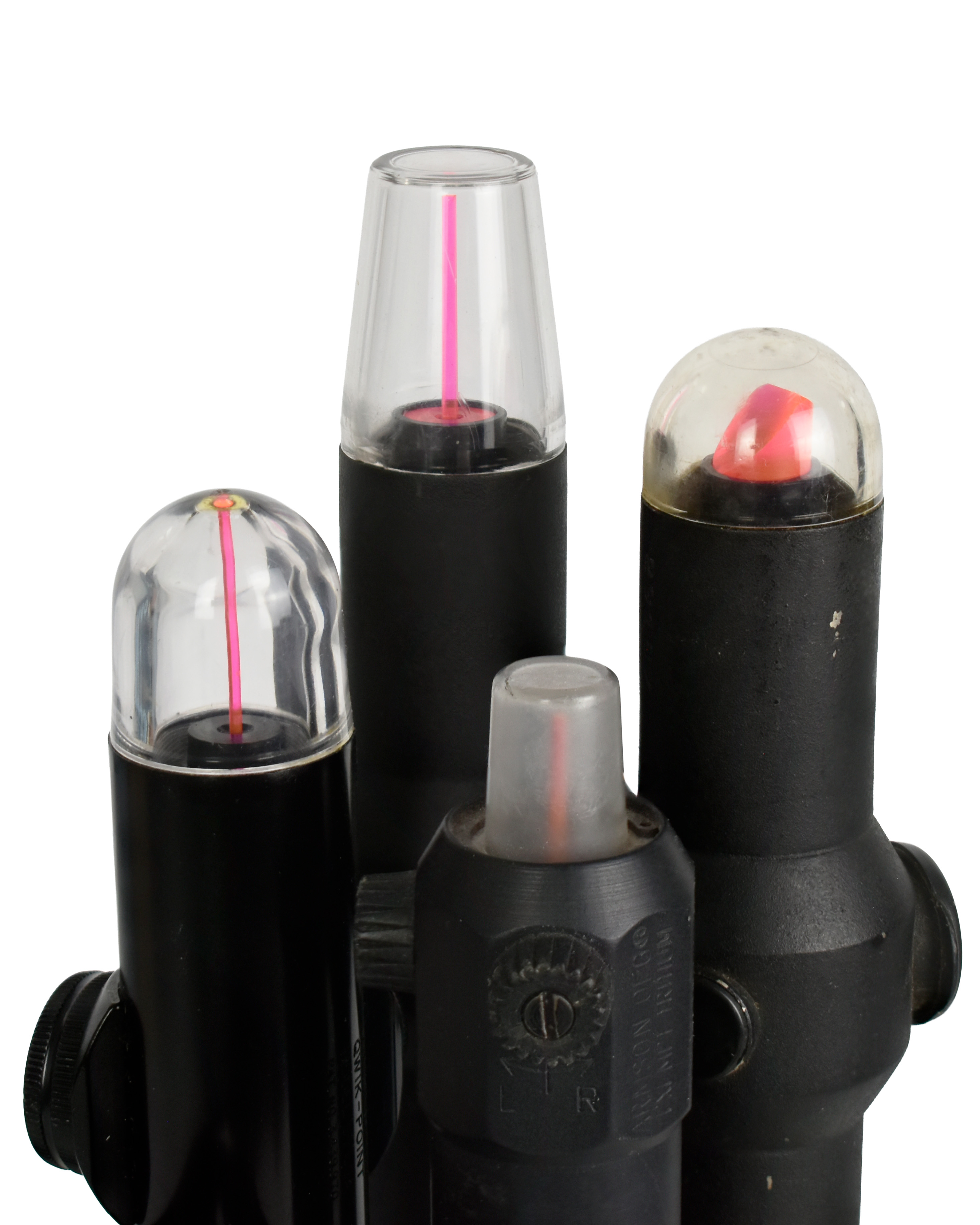 Four different optical sight devices featuring various dome shapes and colors, including a prominent red and pink reticle display.