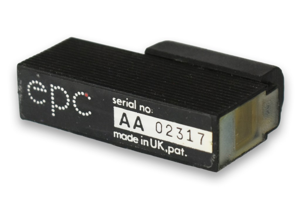 Close-up image of an EPC red dot sight with a serial number and a compact design, highlighting its features.