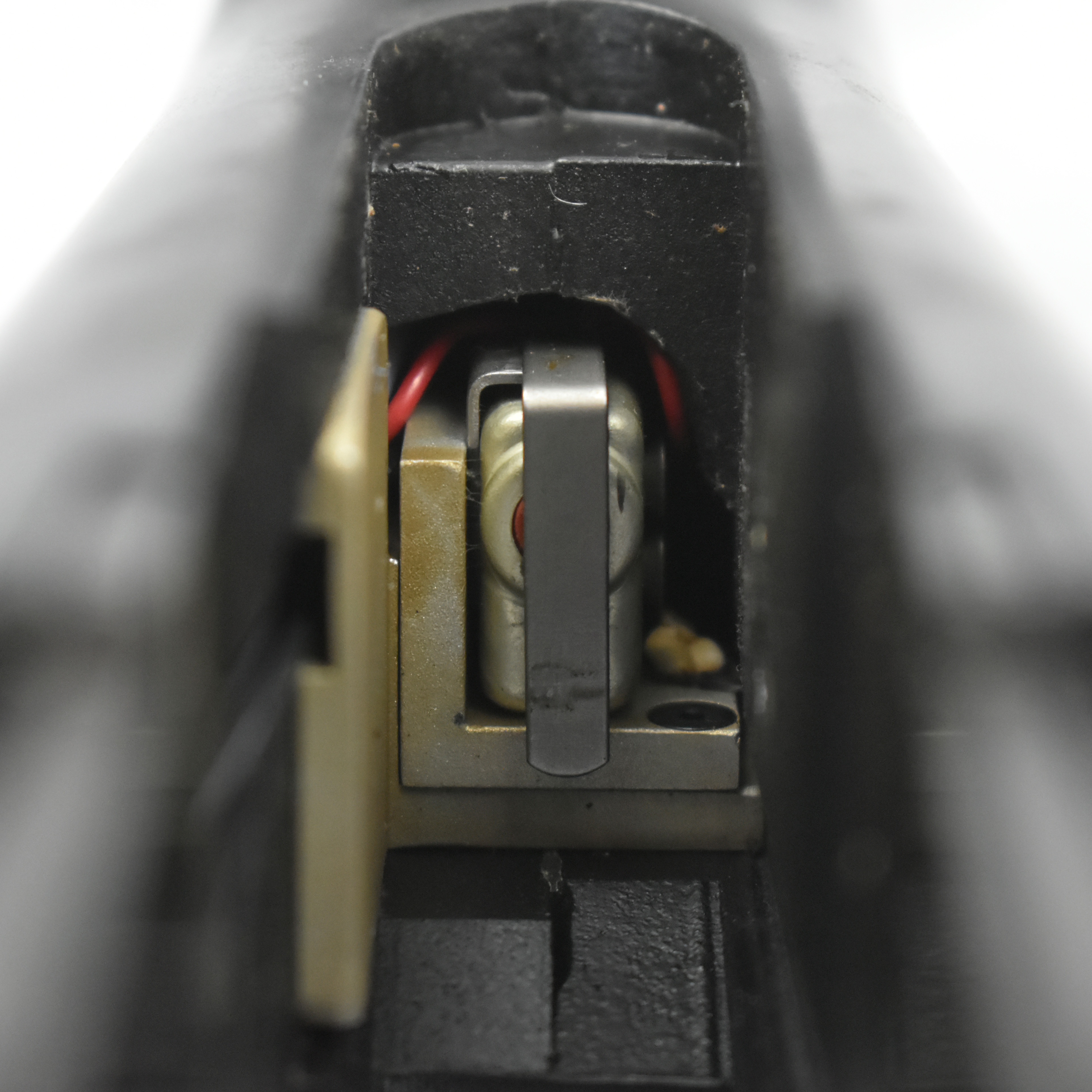 Close-up view of the internal mechanism of a Laser Products Corporation laser device, highlighting its components and wiring.