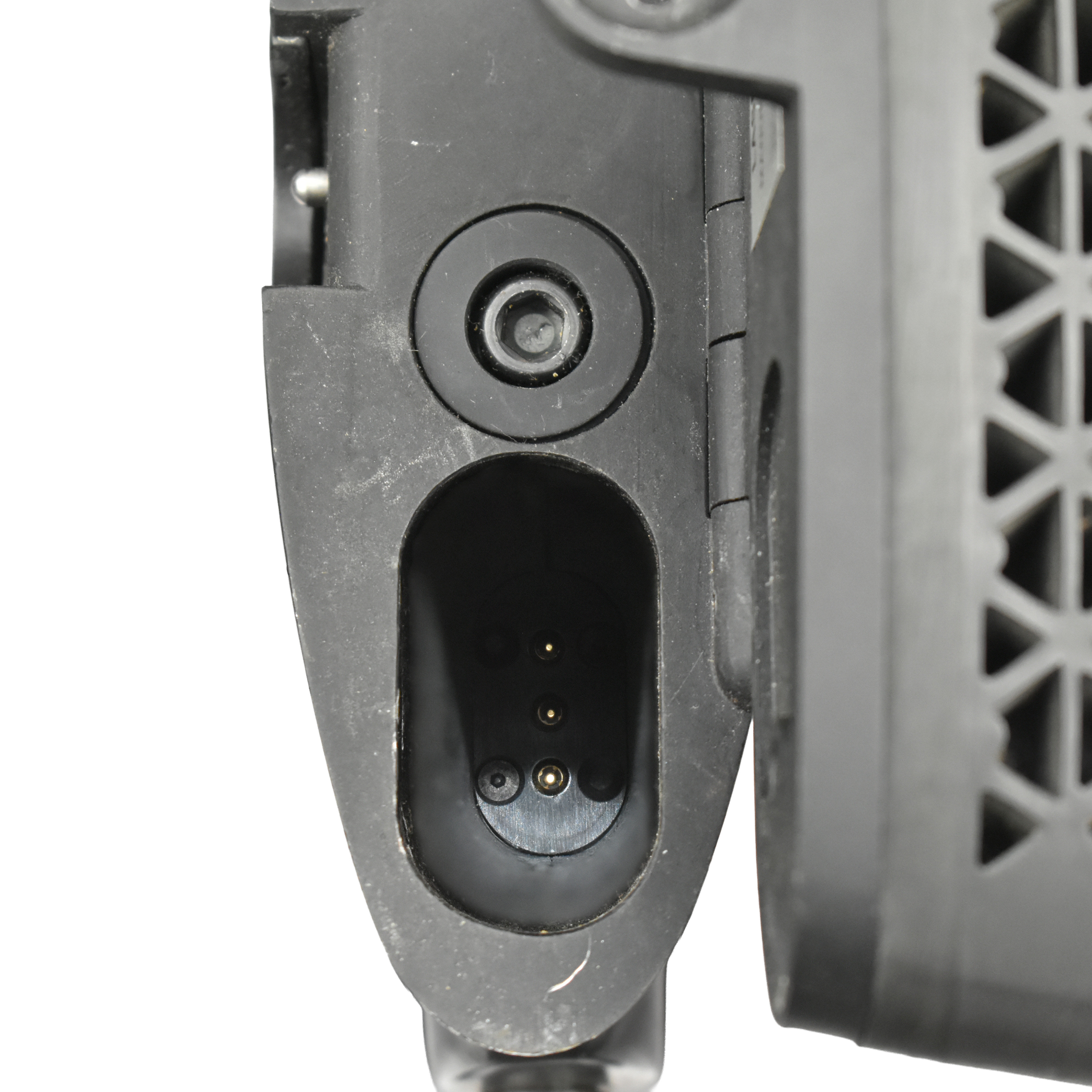 Close-up view of the charging port on the stock of a Ruger Mini-14 laser-equipped rifle, showcasing the connection for power supply.