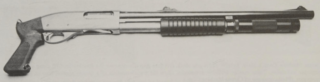 A shotgun with a metal barrel, wooden stock, and a tactical grip, featuring a light attachment and a ribbed pump grip.